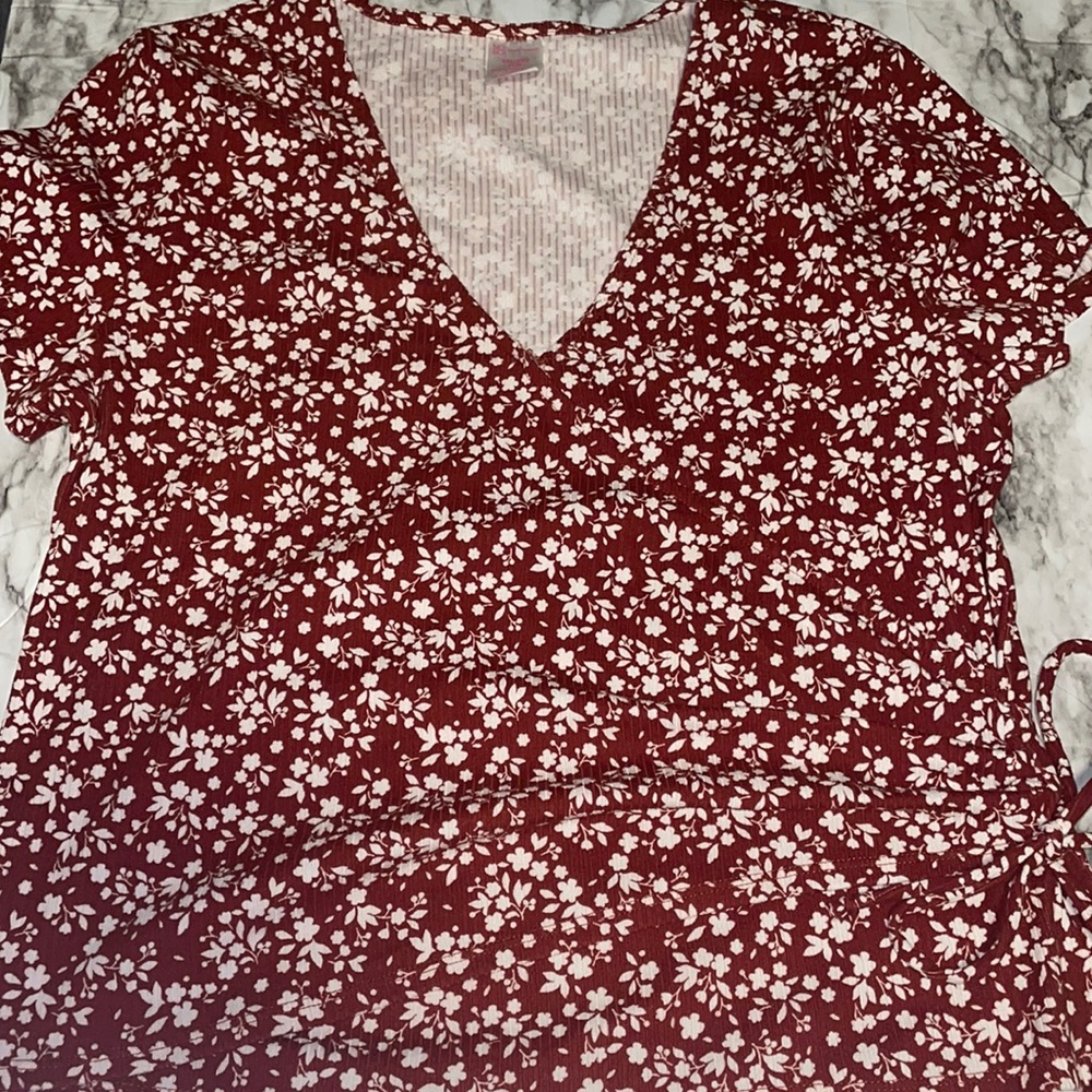 No Boundaries wrap top with flower details